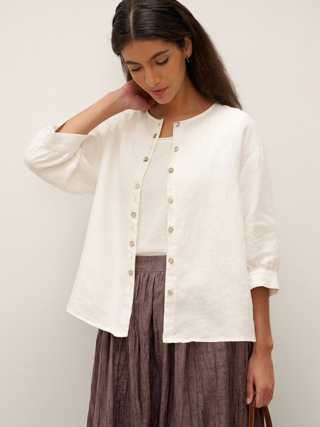 Blusa de lino puro con mangas abullonadas y espalda plisada
