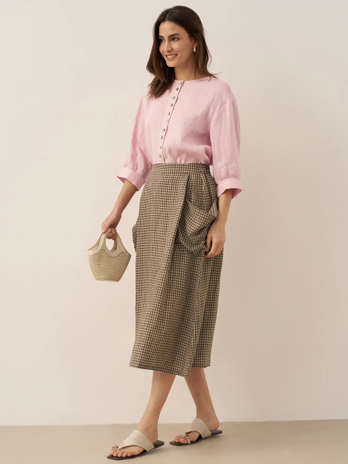 Blusa de lino puro con mangas abullonadas y espalda plisada