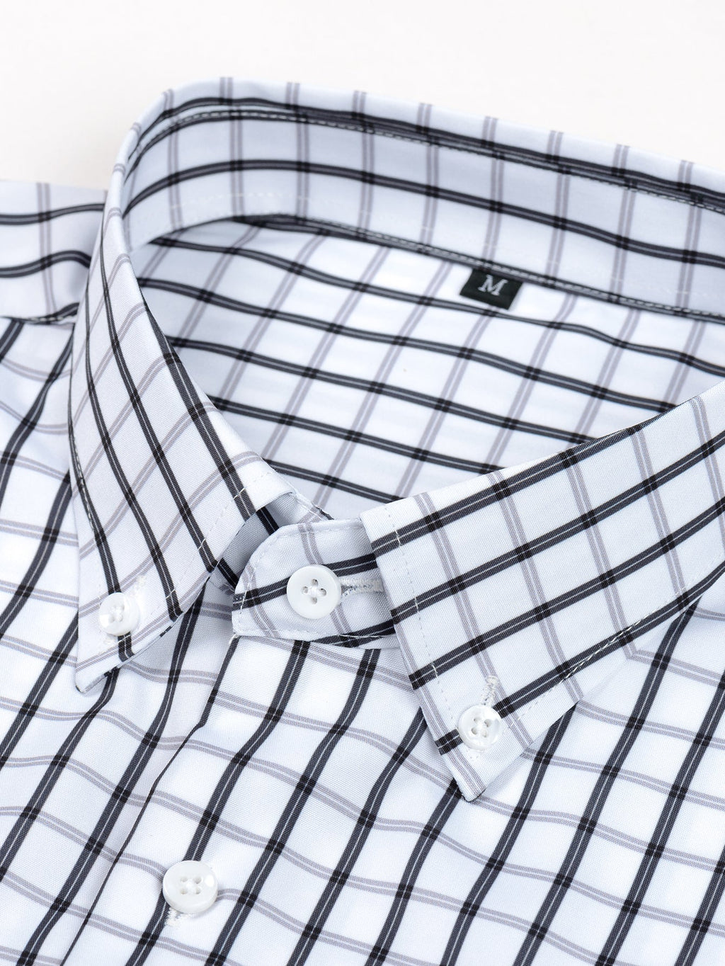 Long-sleeved plaid button-up shirt