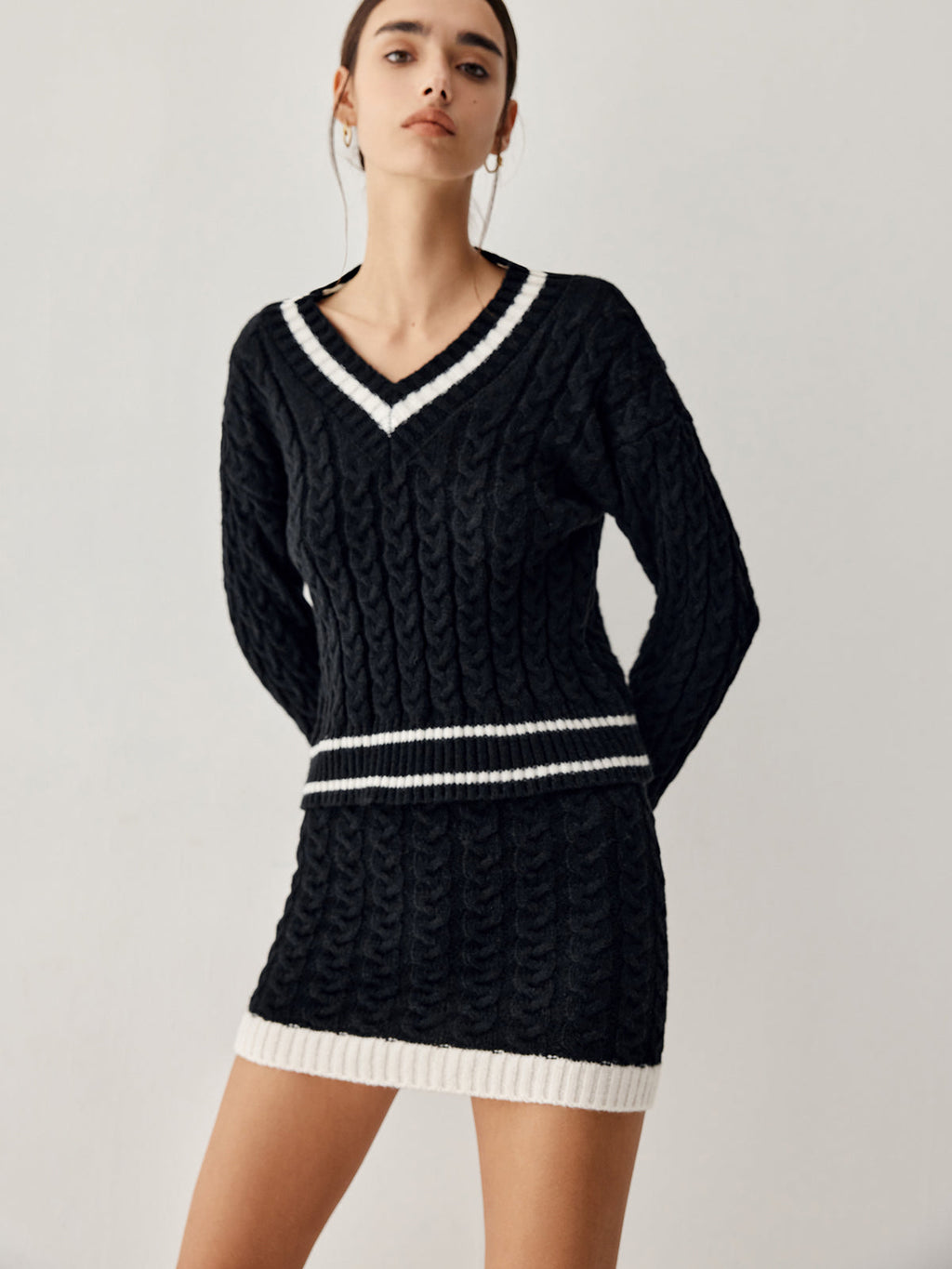 Jersey de punto de ochos con falda