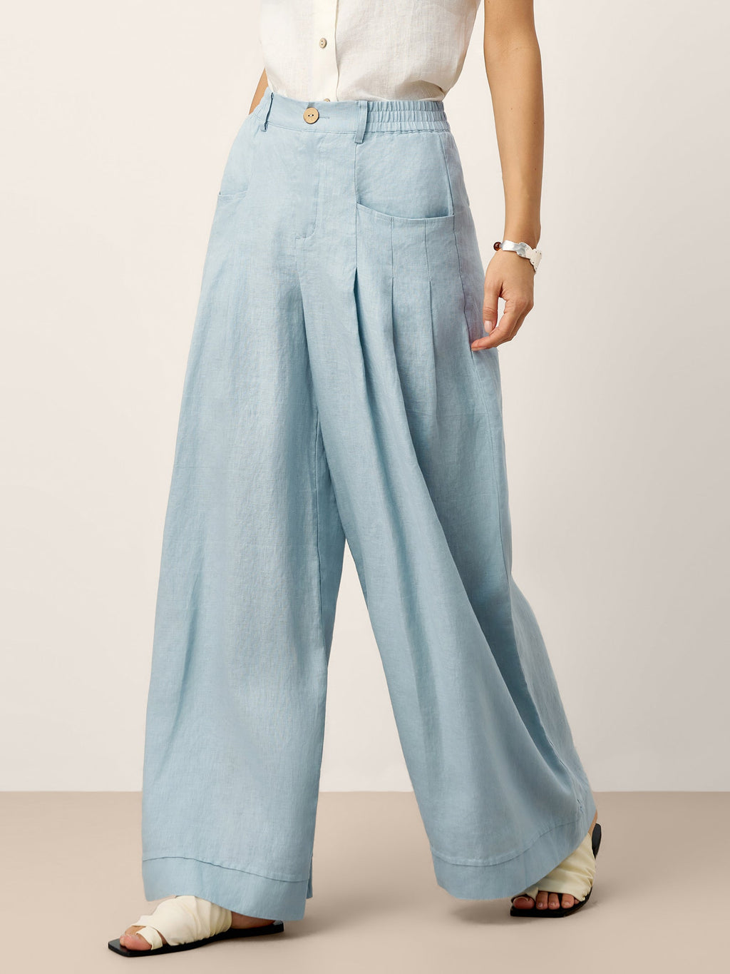 Pantalones relajados con pliegues