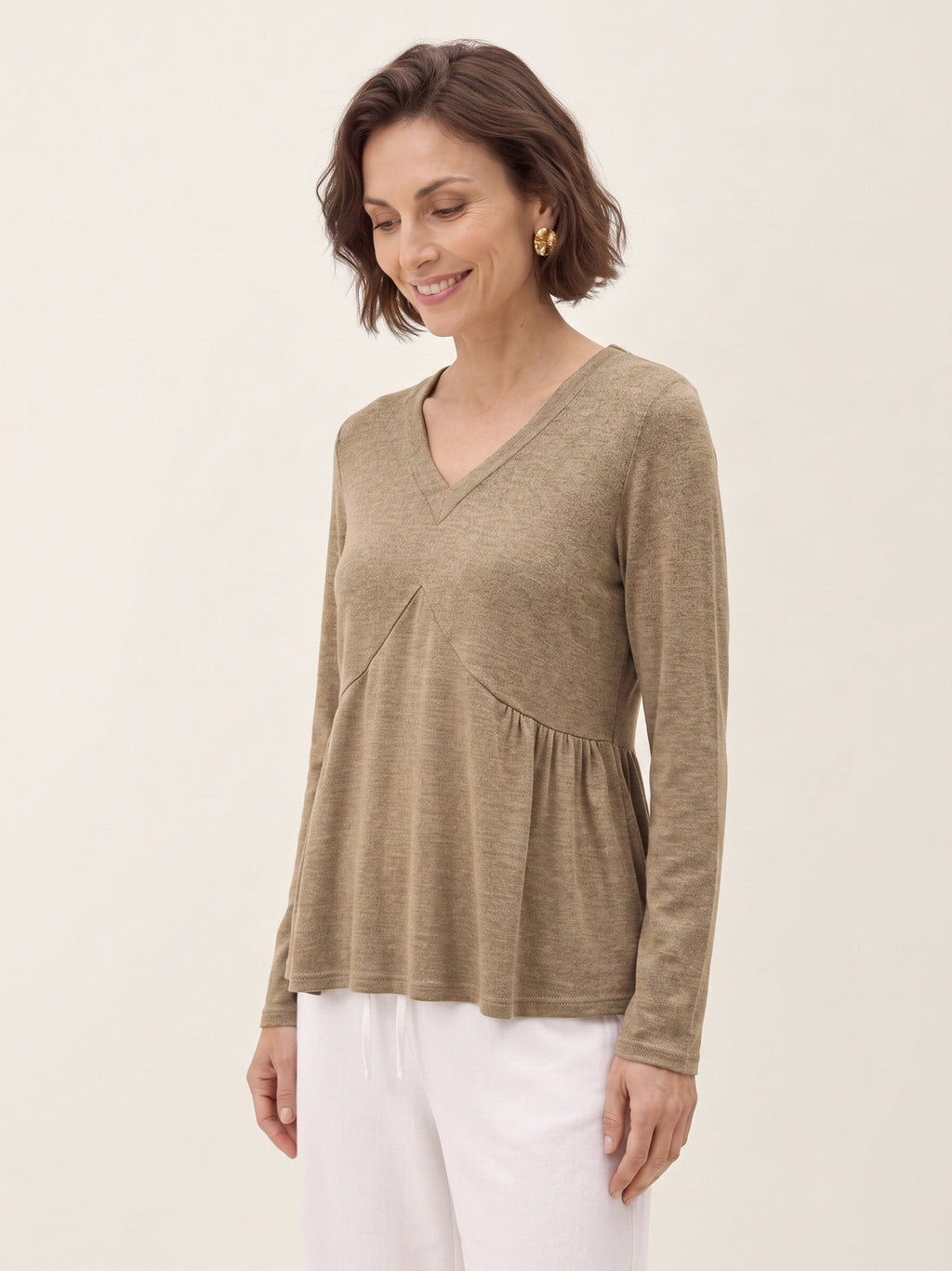 Top de punto con costuras diagonales y peplum